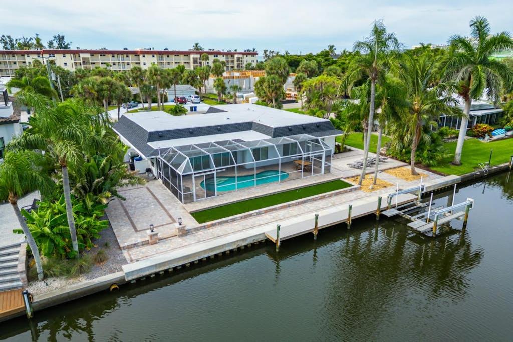 an aerial view of a building next to a body of water at Poseidons Palace in Sarasota