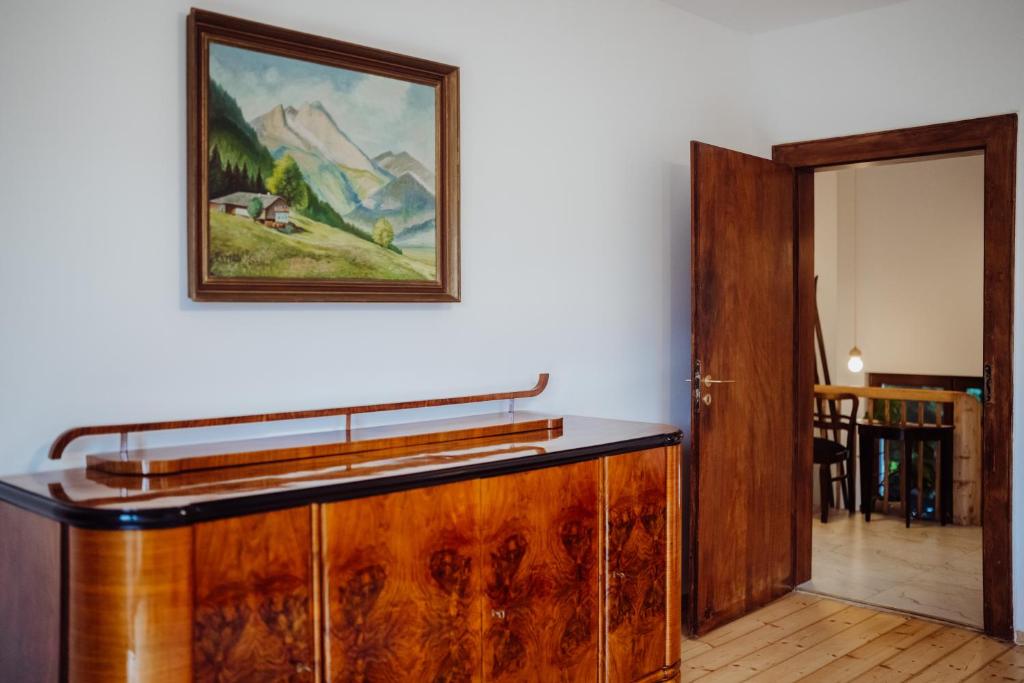 a painting hanging on a wall next to a room at Willa Berg Cieplice in Jelenia Góra