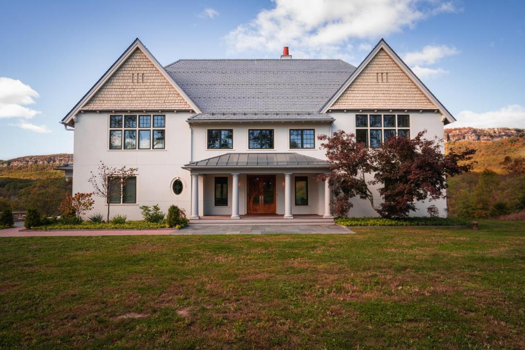 a large white house with a large yard at Greycliff Mohonk Preserve Getaway in New Paltz