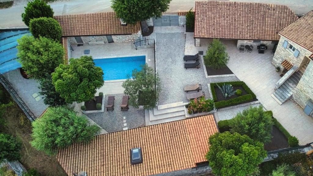 an overhead view of a house with a swimming pool at Heritage Villa Cranzetti in Svetvinčenat