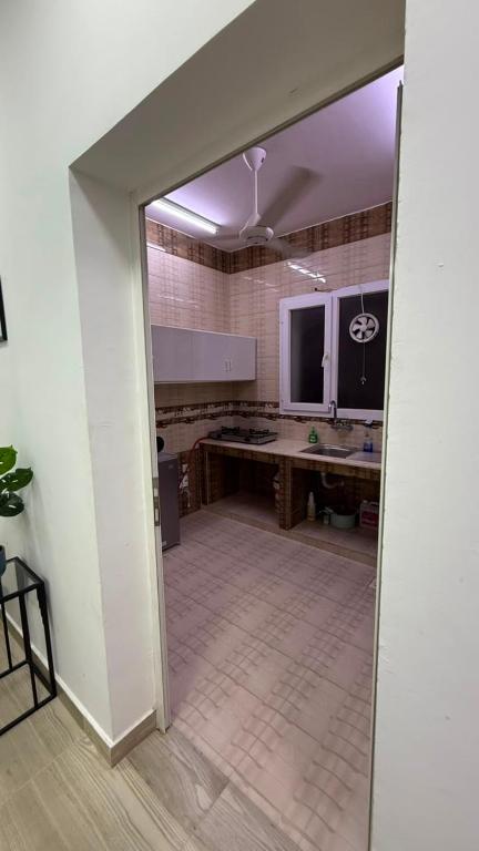 an open door to a room with a kitchen at صلالة صحلنوت in Salalah