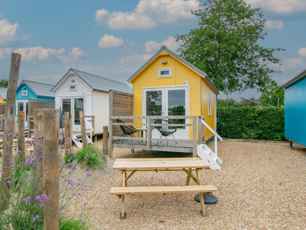 a tiny house sitting on top of a picnic table at Sandy Seven in Ellemeet