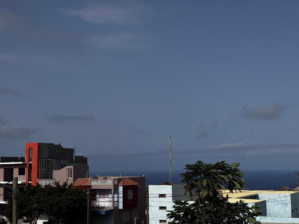 a view of a city with buildings and trees at Maddox's Place in São Filipe