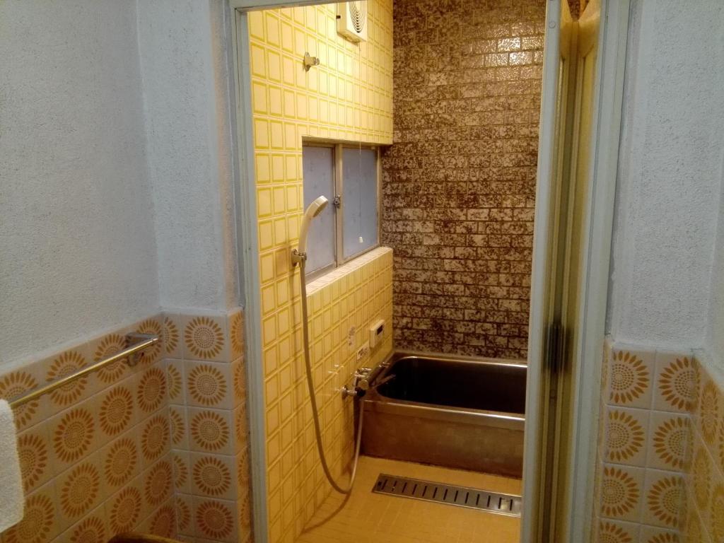 Koupelna v ubytování Ryokan Nakajimaya