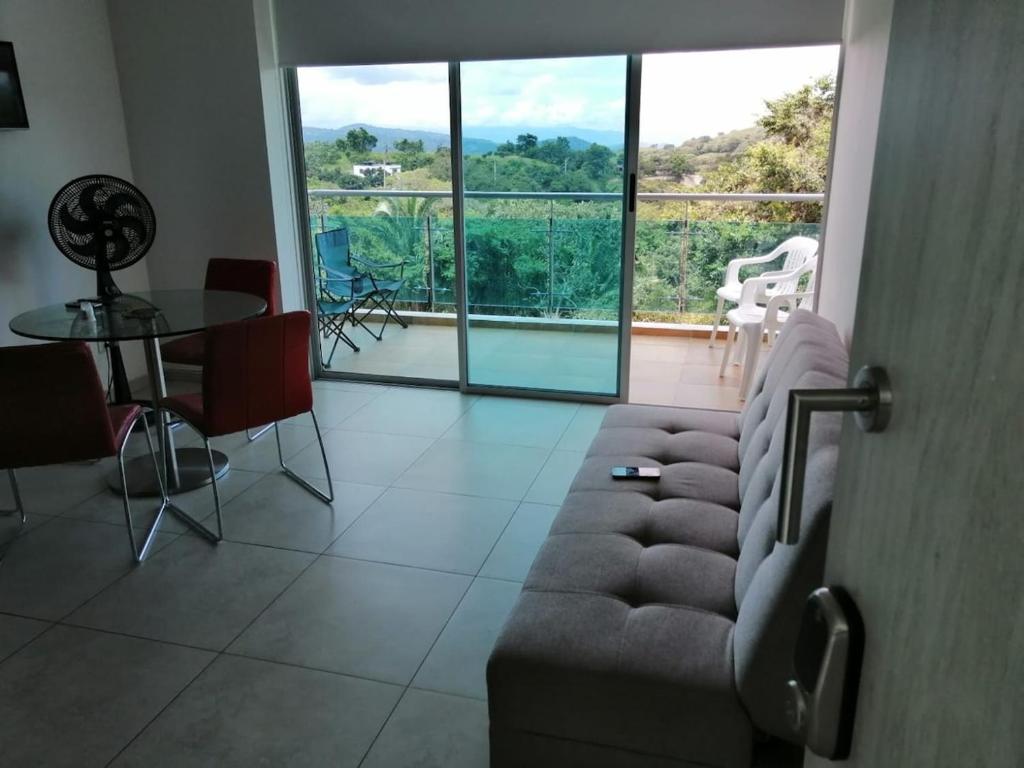 a living room with a couch and a table at Modern apartment with pool-La Mesa in La Mesa