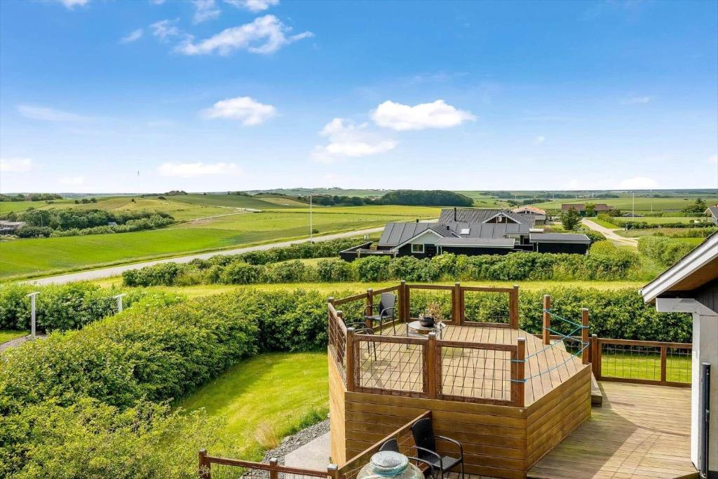 an outdoor deck with a view of a house at G213-Lemvig-Skovstjernevej-13 in Lemvig