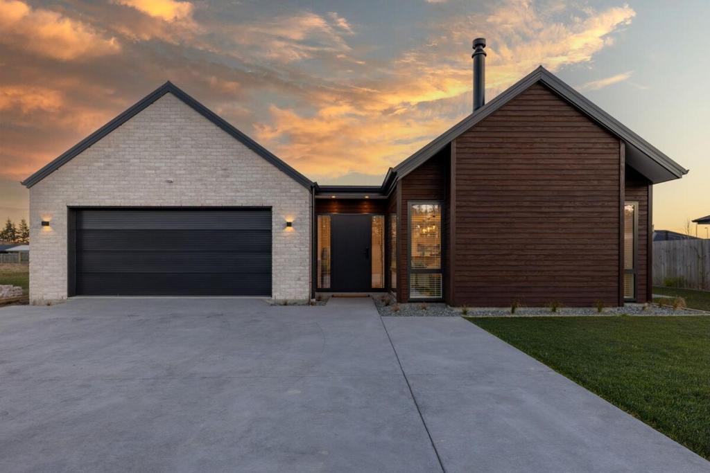 a house with a garage in a driveway at Alpine Retreat in Methven