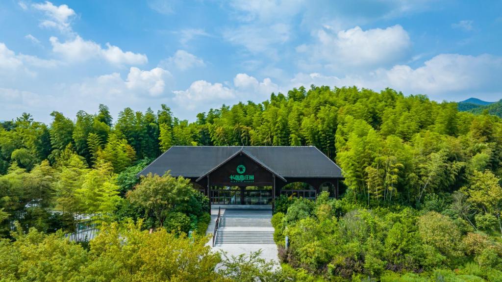 an aerial view of a building in the middle of a forest at HuzhouGiraffe ManorHotel in Huzhou