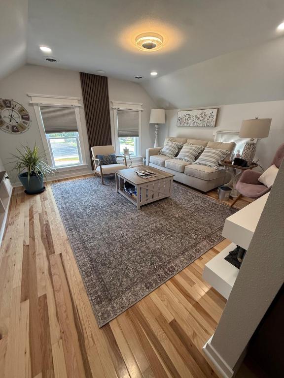 a living room with a couch and a table at Gorgeous Home in Prime Location in Sauk City