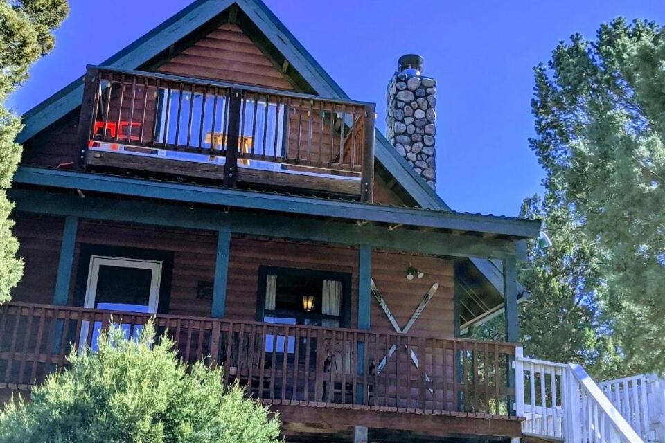 a house with a deck and a balcony at Serene A-frame Cabin Pet Friendly Panoramic View in Sun Valley