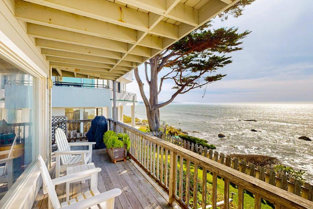 a porch of a house with a view of the ocean at Oceanfront Delight in Cayucos