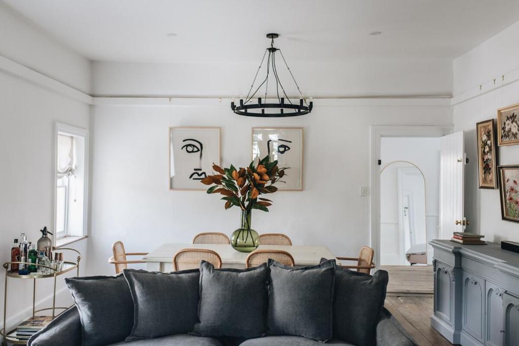 a living room with a couch and a table at The Berrima Vault House in Berrima