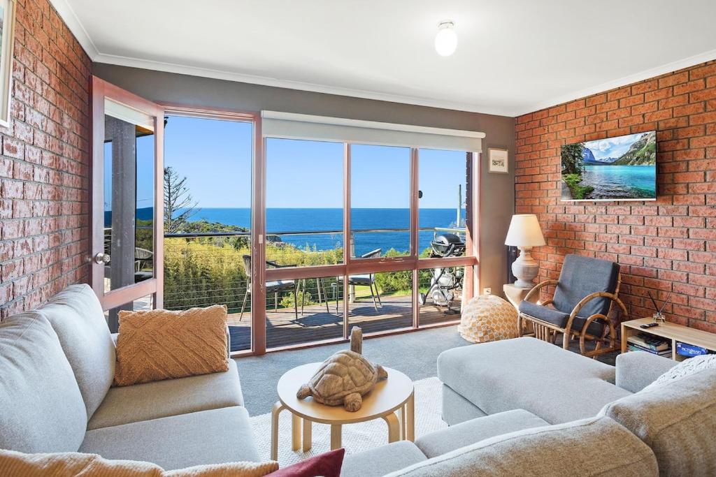 a living room with a view of the ocean at Viewpoint in Tathra