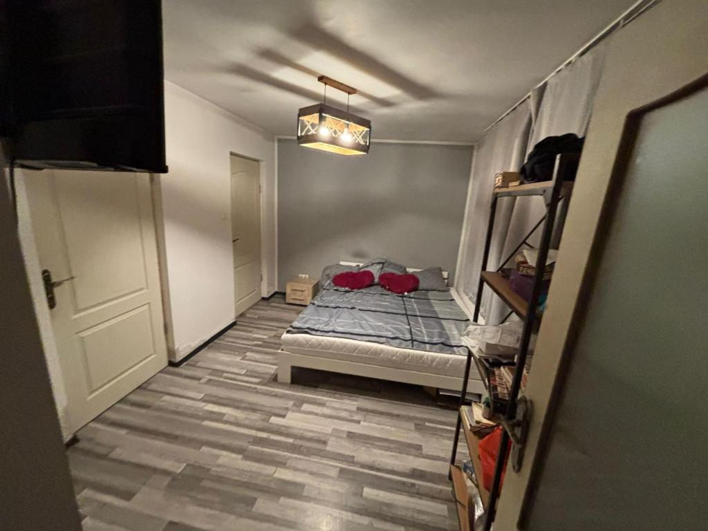 a small bedroom with a bed in a room at Fele&Ami house in Bontida