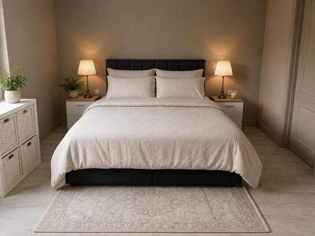 a bedroom with a large bed with two night stands at Cosy apartment - Na Creagáin in Tully
