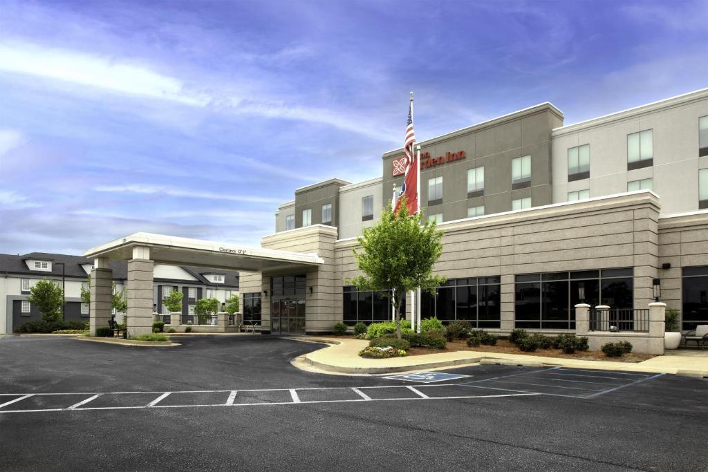 an empty parking lot in front of a hotel at Hilton Garden Inn Jackson in Jackson