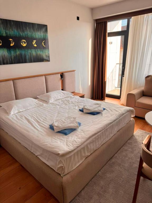 a bedroom with a large bed in a room at Ilshat mini hotel in Cholpon-Ata