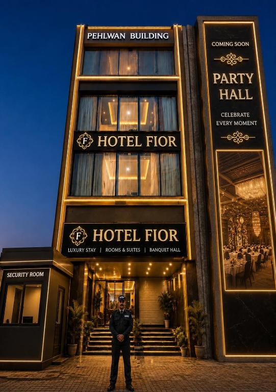 a police officer standing in front of a hotel at hotel fior in Pānīpat