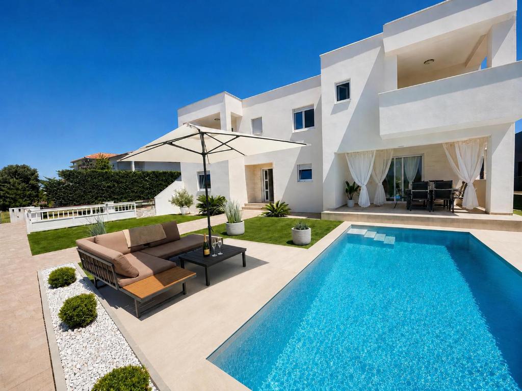 a villa with a swimming pool in front of a house at Mare Nostrum Suite in Vir