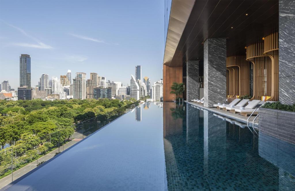 a infinity pool with a view of the city at Andaz One Bangkok, by Hyatt in Bangkok