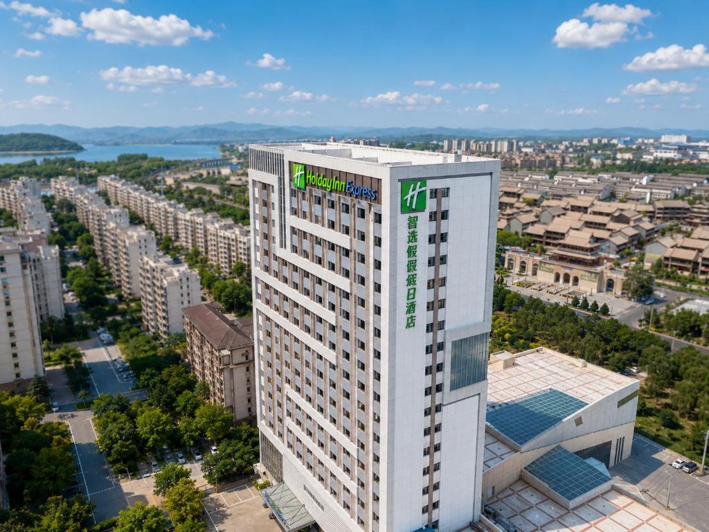 an aerial view of a tall white building at Holiday Inn Express Zhangye by IHG in Zhangye