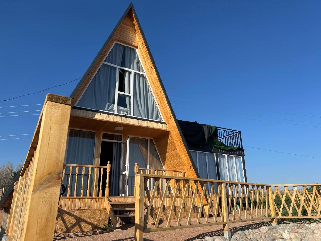 a tiny house with a gambrel roof at Esal Rest Zone in Tong