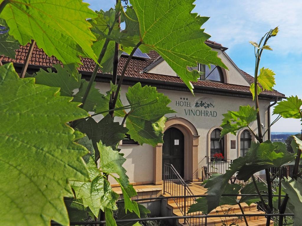a building with a sign that reads hotel windward at Hotel Vinohrad in Milotice