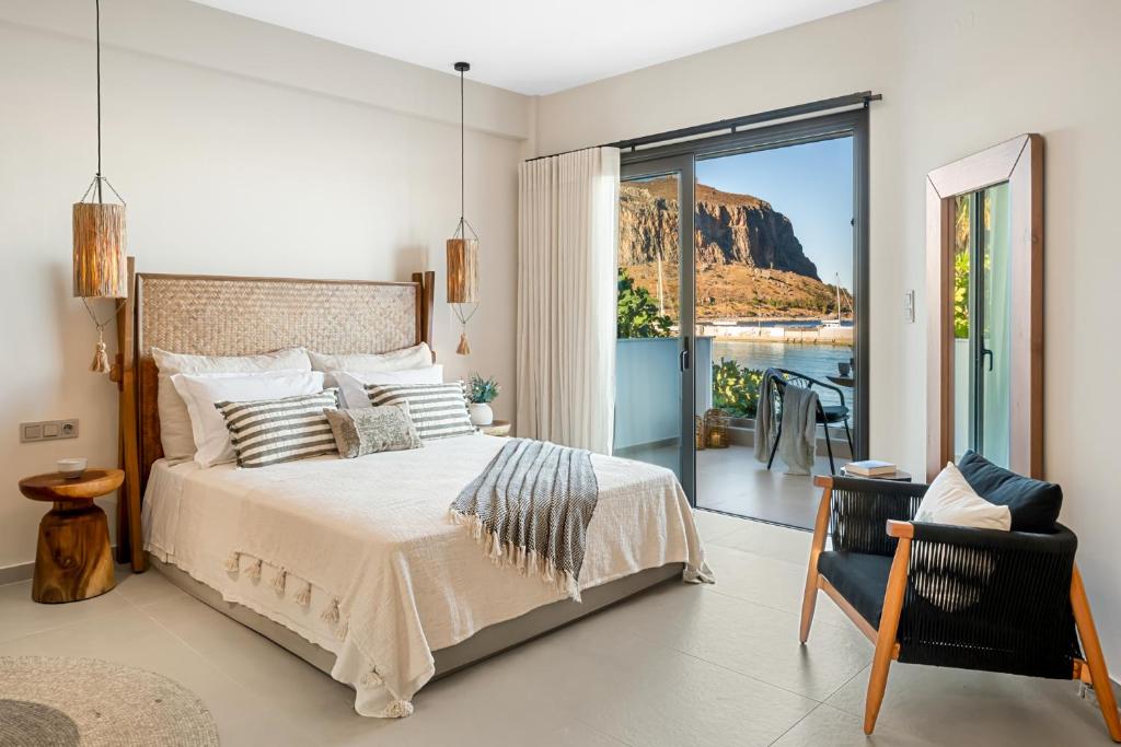 a bedroom with a bed and a view of a mountain at Gaia-Castle vista in Monemvasia