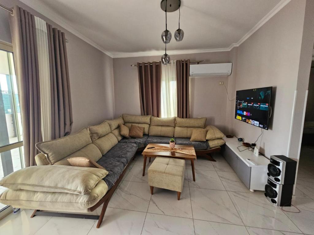 a living room with a couch and a table at Arlis House in Golem