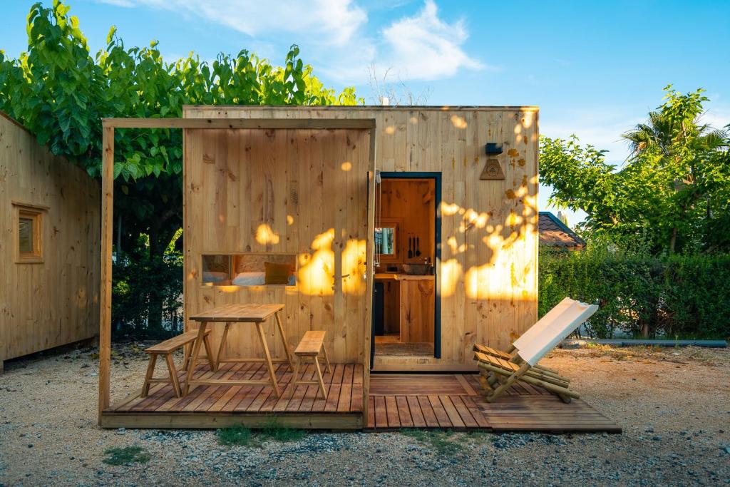 a small wooden shed with a table and a desk at Kampaoh Playa de Levante in Benidorm