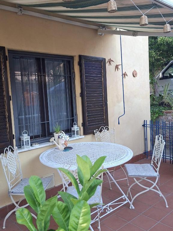 a table and chairs sitting on a patio at Angolo Azzurro in Asciano Pisano