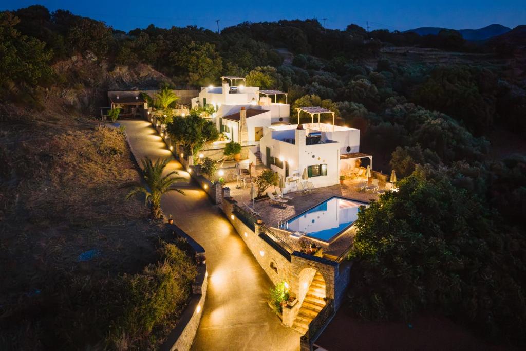 an aerial view of a villa with a swimming pool at Metochi Villas in Spílion