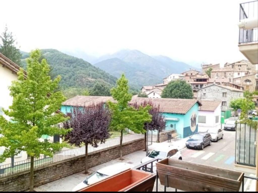 a view of a town with cars parked on a street at Pis Relapieso in Vilaller