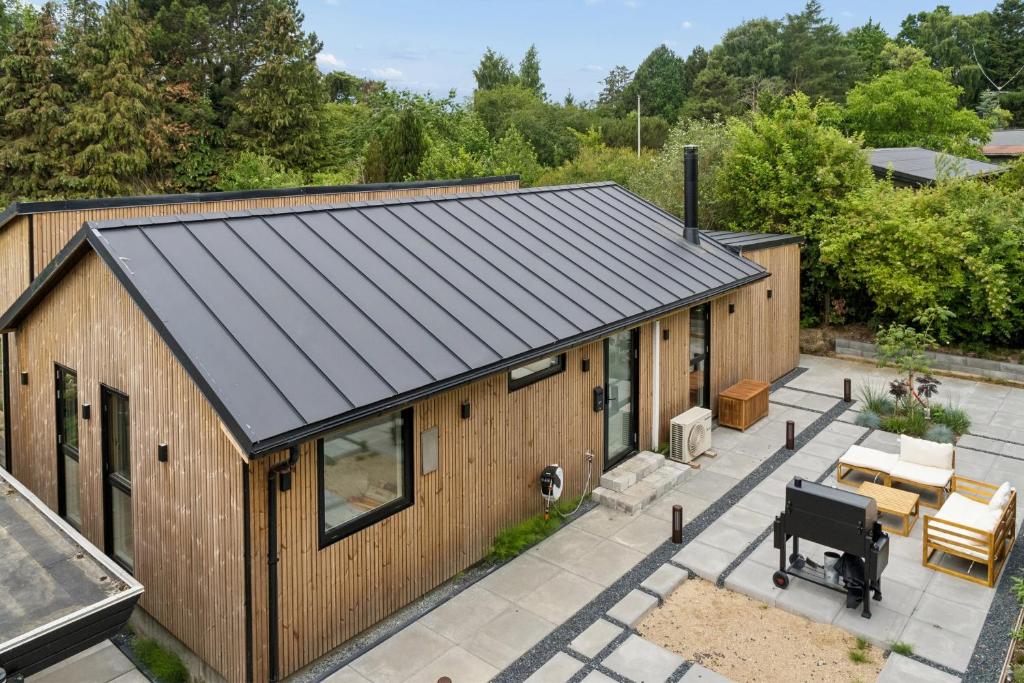 an overhead view of a house with a metal roof at Newly Renovated Cottage With Sauna in Melby