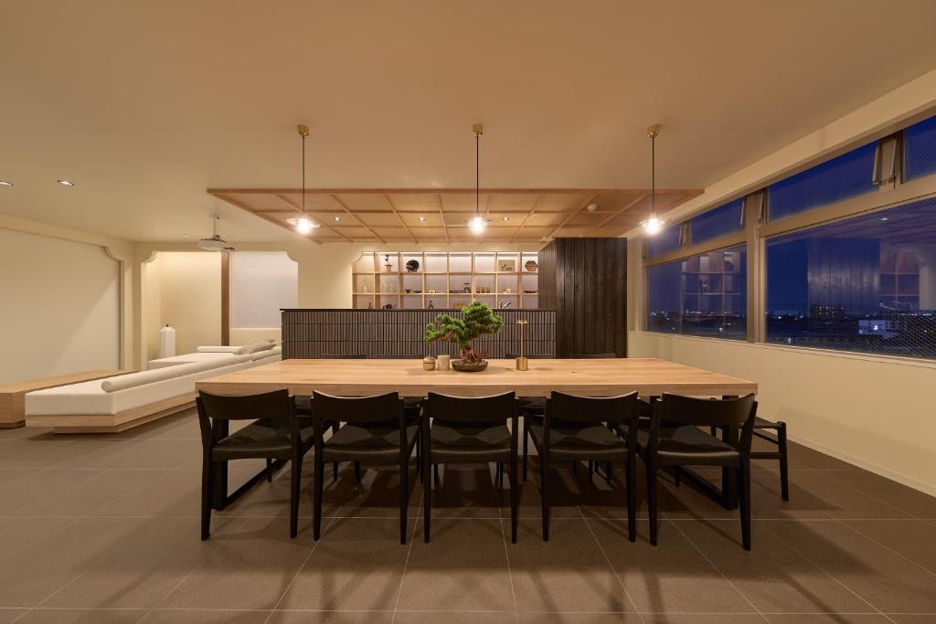a dining room with a table and chairs at AO Odawara Lounge in Odawara