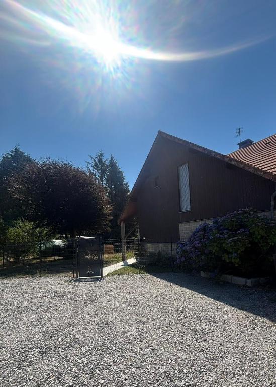 a building with the sun in the sky at Maison familiale in La Souterraine