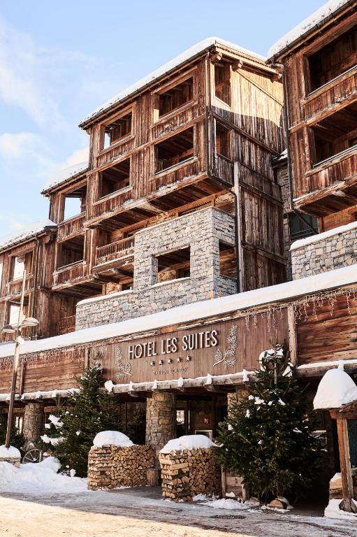 a building with a hotel les suites written on it at Les Suites – Maison Bouvier in Tignes