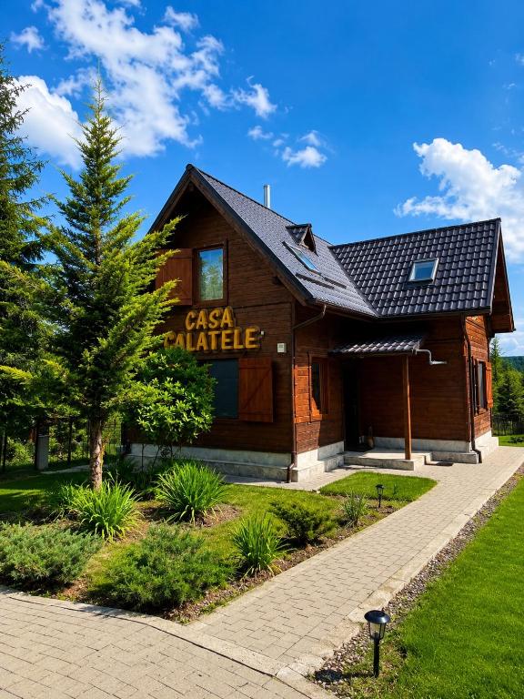 a building with a sign that reads casa palacio at Cabana Călățele in Călăţele