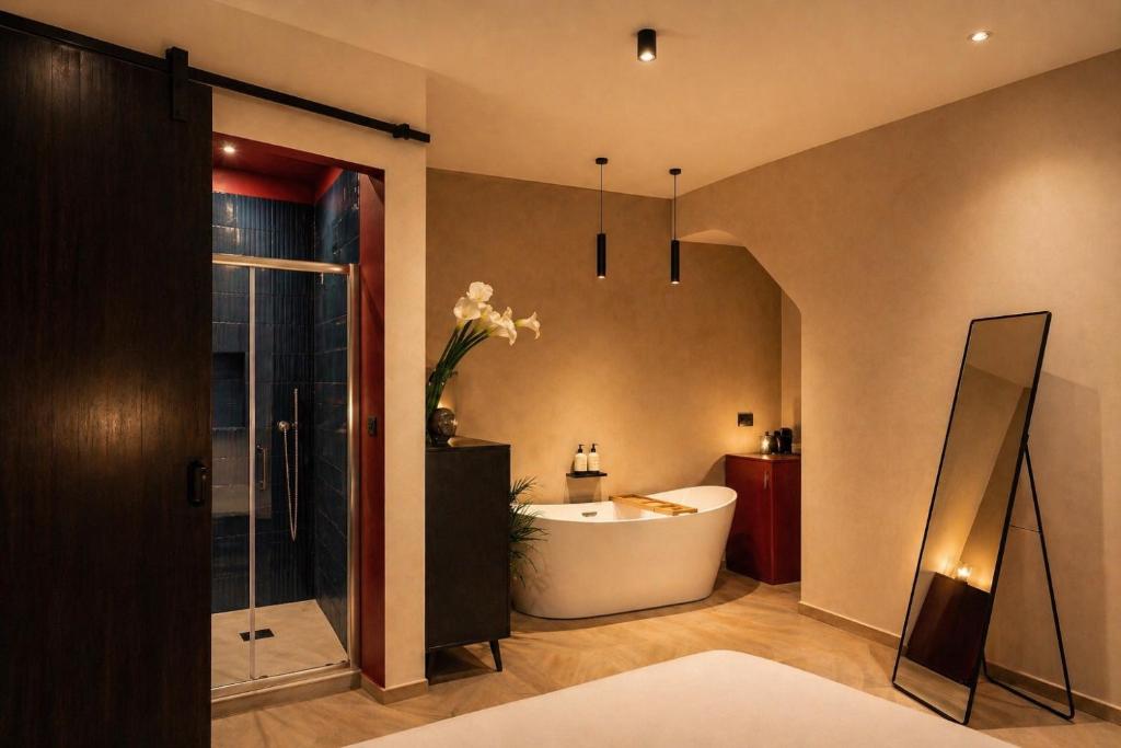 a bathroom with a tub and a sink at L'ateneo Lumiére in Agrigento