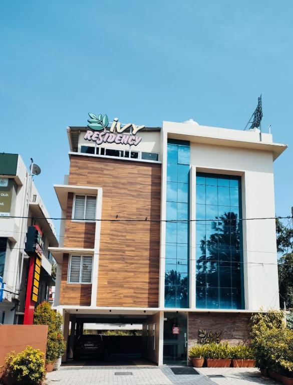 a building with a sign on top of it at IVY RESIDENCY in Trivandrum