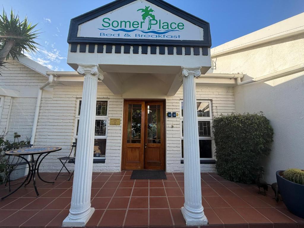 a building with a sign that reads some place teach to worship at Somer Place B&B in Somerset West