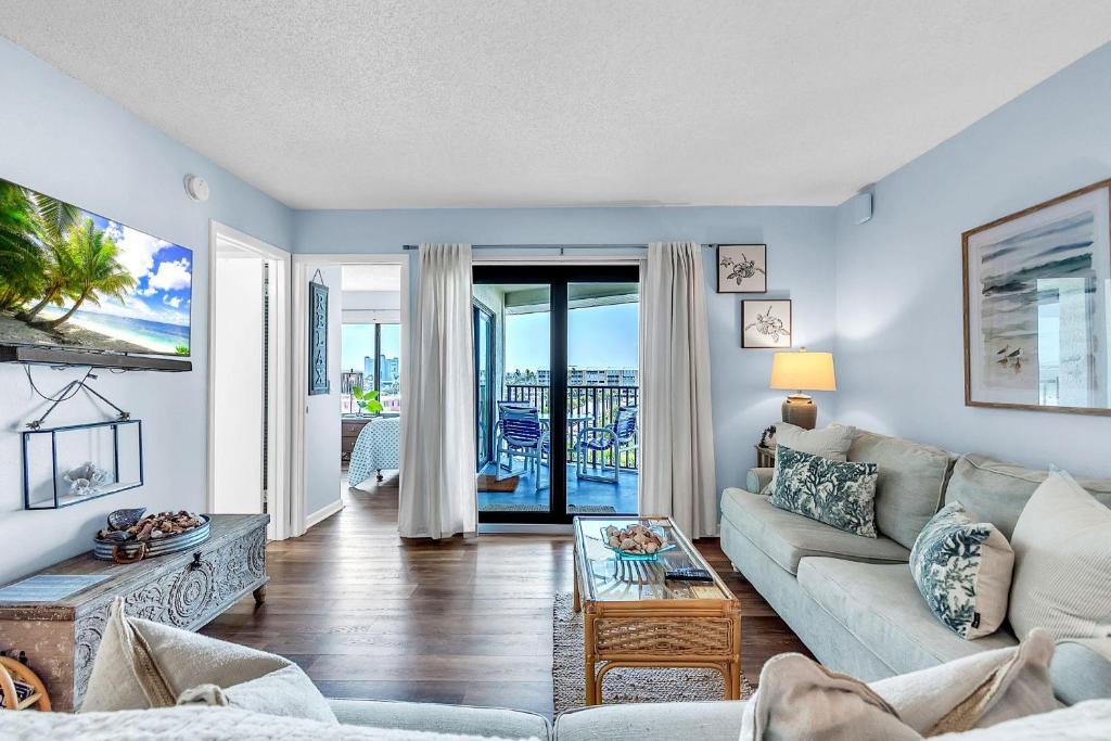 a living room with a couch and a table at Caprice 501 in St. Pete Beach