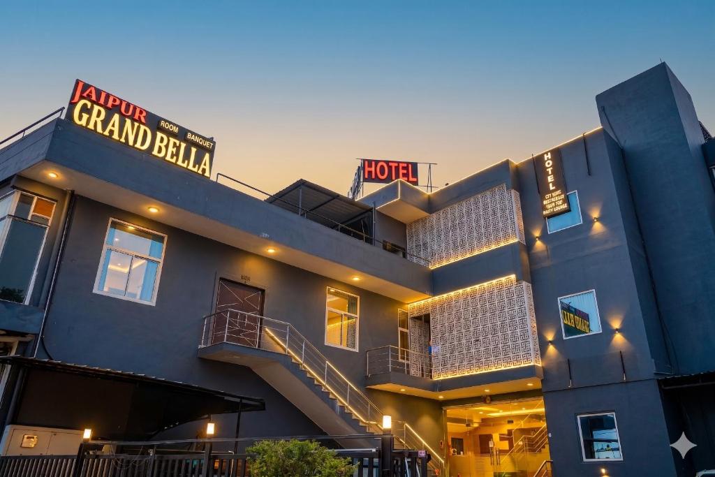 a blue building with a spiral staircase in front of it at Jaipur Grand Bella in Jaipur