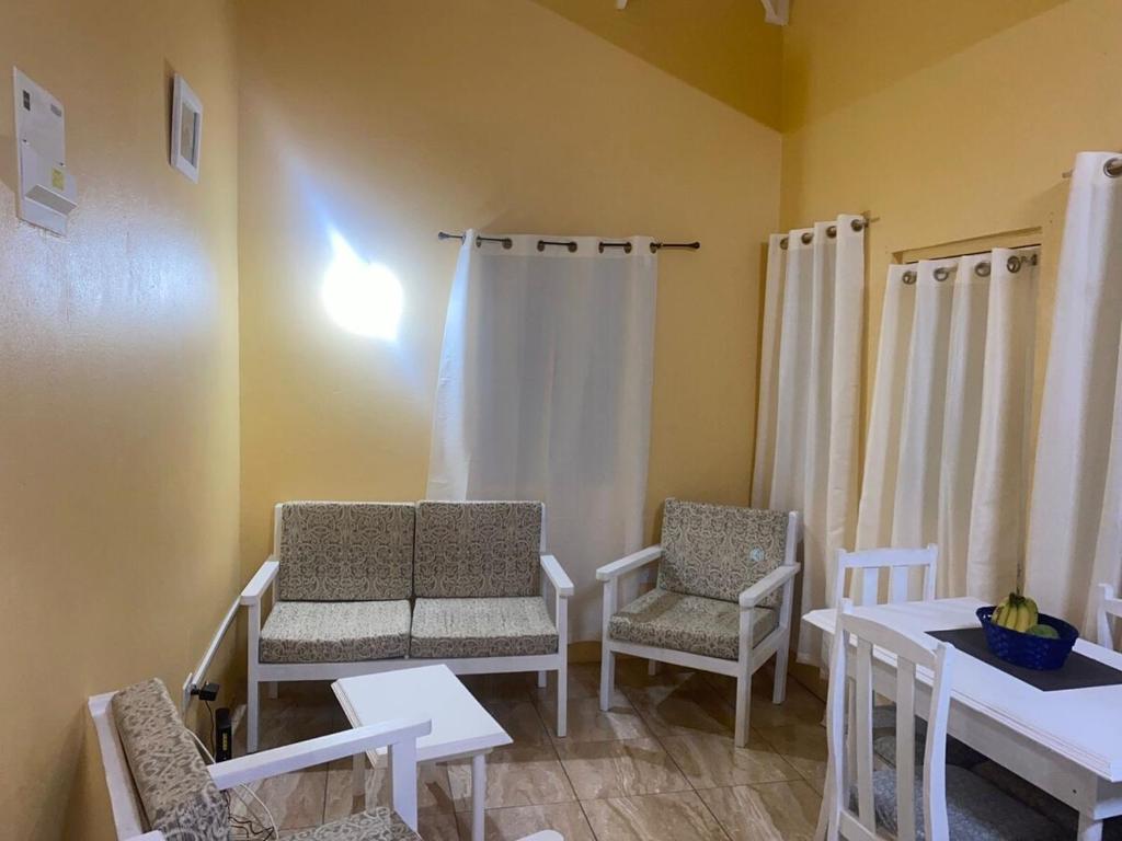 a room with two chairs and a table and a table and chairsktop at Country Green in La Feuillet