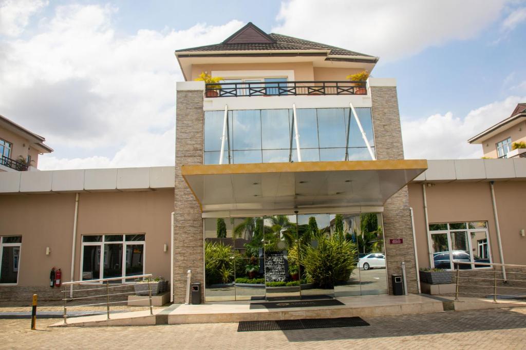 a building with a balcony on top of it at Amber Residence GRA Ikeja in Ikeja