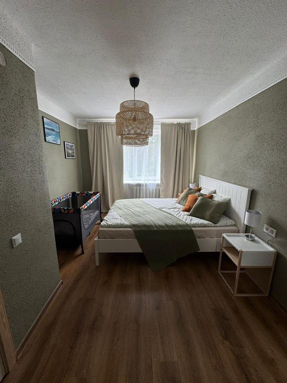 a bedroom with a bed and a window at Sunset Stay in Kolka in Kolka
