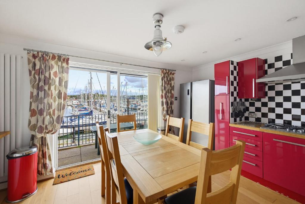 a kitchen with a table and a view of a harbor at Marina View in Plymouth