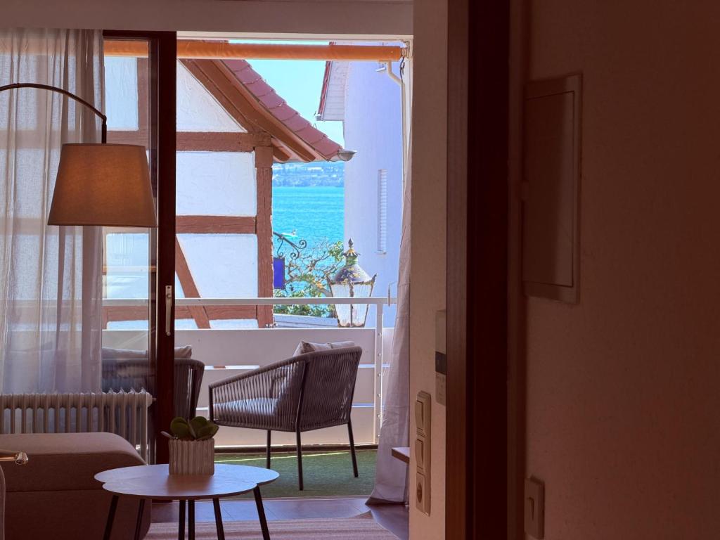 a living room with a view of the ocean at Lakeside No 9 in Hagnau