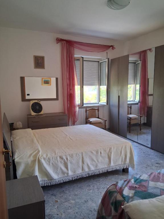 a bedroom with a large bed and a window at Casa Sirente, Via Monte Sirente n 51 in Francavilla al Mare