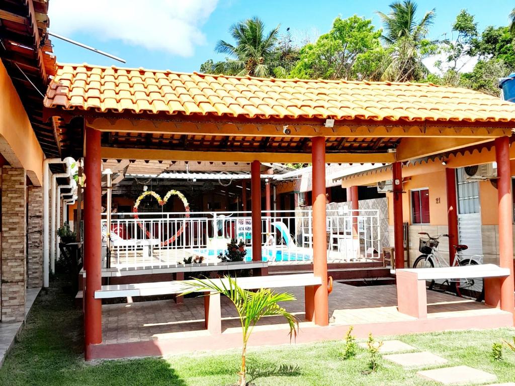 a pavilion with a pool in a house at Pousada Açaí in Salvaterra